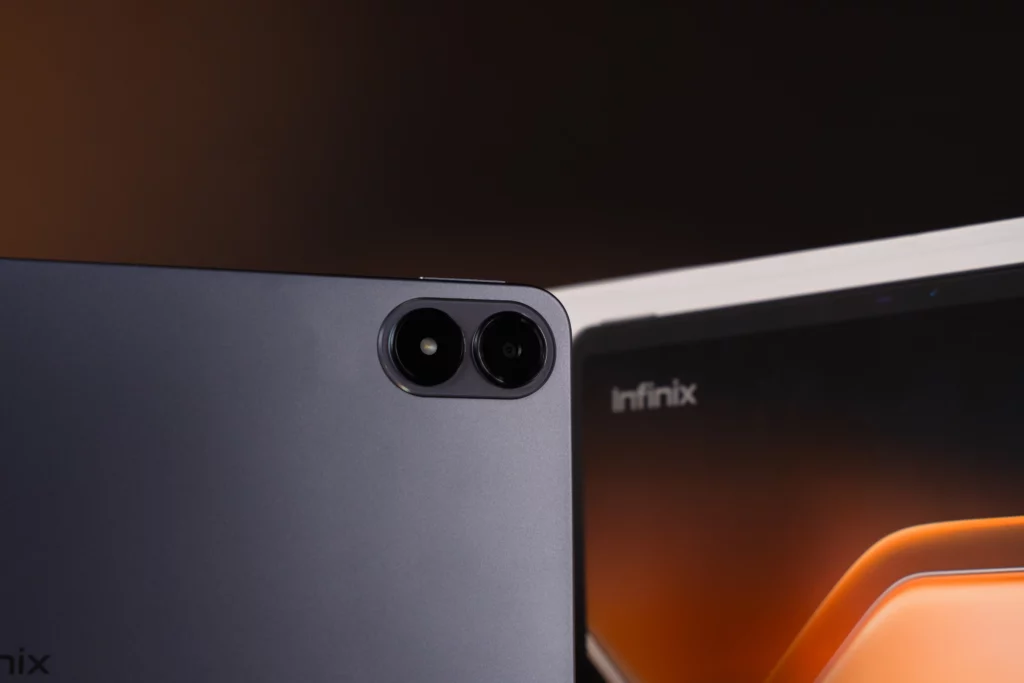 infinix xpad 20's camera module in front of its box.