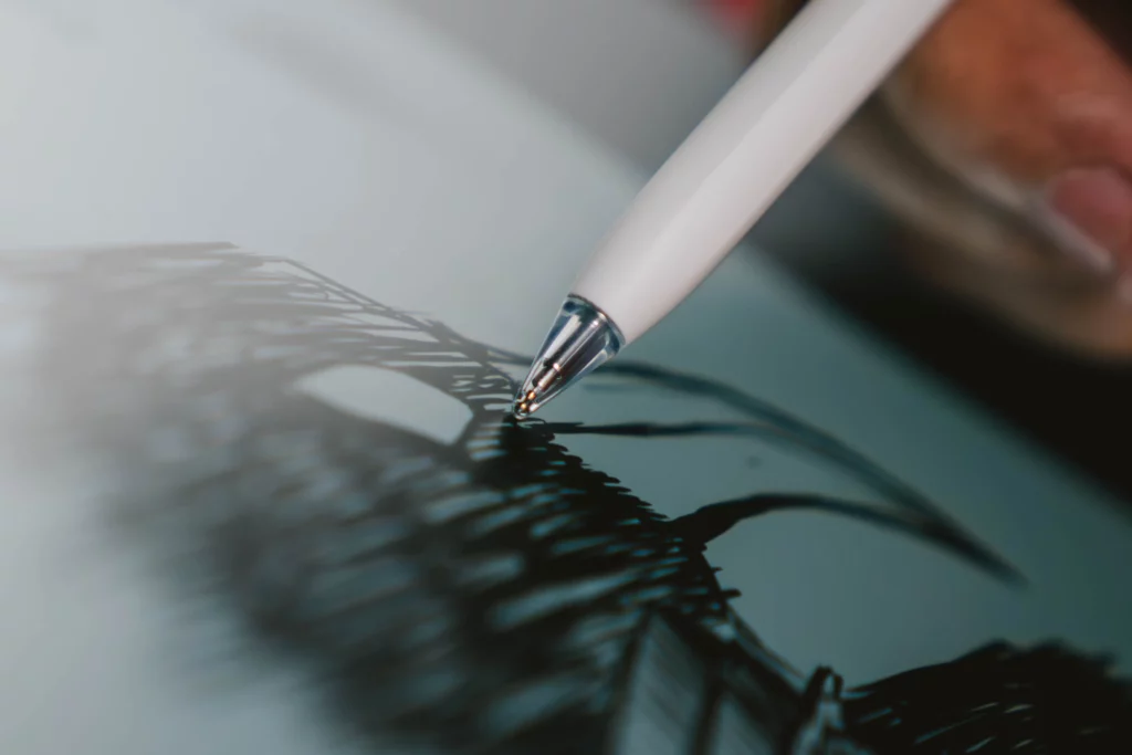 A detailed, close-up shot of the tip of the HUAWEI M-Pencil as it touches the screen of the MatePad 11.5, showing the smooth drawing experience.