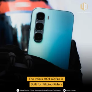 A close-up shot of the back of a light blue Infinix HOT 60 Pro smartphone with a triple-camera system. A gloved hand is holding the phone, with a motorcycle helmet visible in the blurry background. A yellow box at the bottom of the image reads: "The Infinix HOT 60 Pro is Built for Filipino Riders". The "Unbox Diaries" logo is in the top right corner, and social media handles are listed at the very bottom.