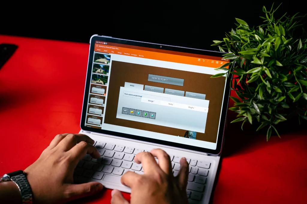 A person's hands using the white smart keyboard to navigate a presentation on the HUAWEI MatePad 11.5, demonstrating the tablet's use for professional or academic tasks.