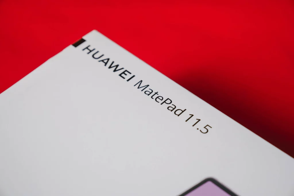 A close-up of the HUAWEI MatePad 11.5 tablet box, with the text 'HUAWEI MatePad 11.5' visible in black, set against a vibrant red background.