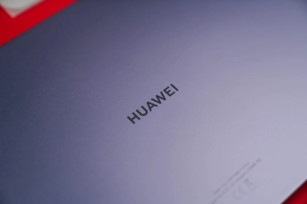 A close-up of the back of the space gray HUAWEI MatePad 11.5 tablet, showing the sleek metal unibody design and the HUAWEI logo engraved in the center.
