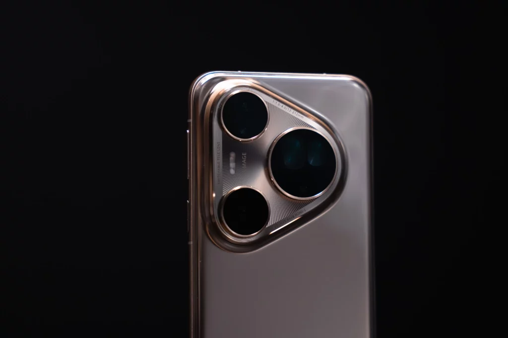 Close-up of the HUAWEI Pura 80 Ultra's triple-camera system, showing the symmetrical, circular lens arrangement and the 'ULTRA IMAGE' branding etched into the metallic finish.