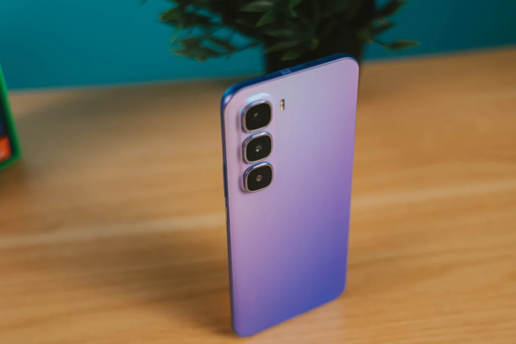 Angled shot of the purple Infinix HOT 60 Pro+ back, showcasing its slender profile and triple camera setup.