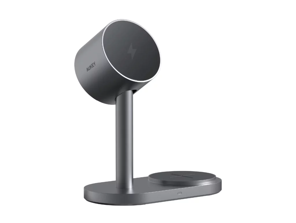 A 3D rendering of a gray AUKEY MagFusion 2X magnetic wireless charging stand on a white background. The stand features a vertical charging pad and a secondary flat charging base.