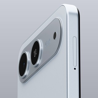 A close-up, angled view of the back of a silver Tecno Spark Go 5G, focusing on the dual-camera module and the SIM card tray on the side.