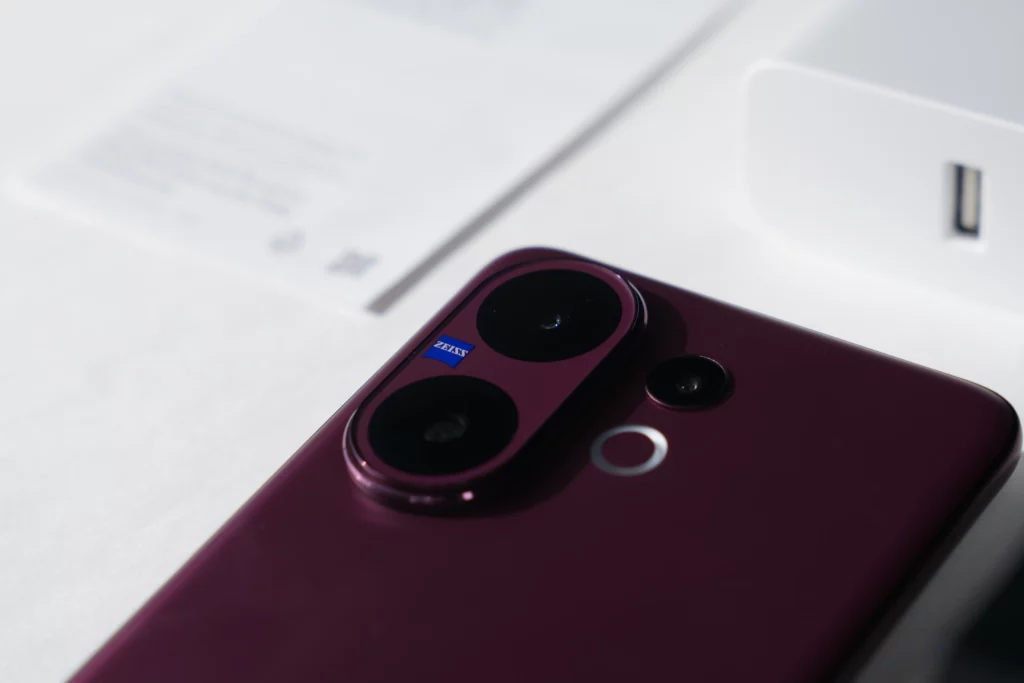 A macro shot of the Vivo V60's back camera module, showcasing the ZEISS branding and the two lenses with the flash ring light.