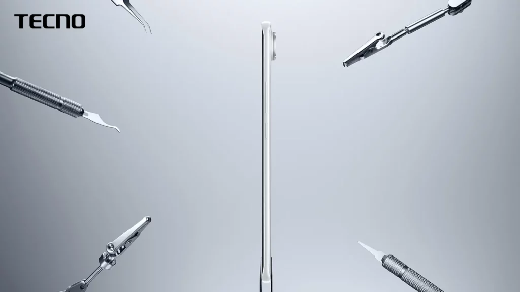 A side-profile view of a thin, white TECNO smartphone, highlighting its slim design. Various metallic tools are positioned around it, emphasizing its sleek build.