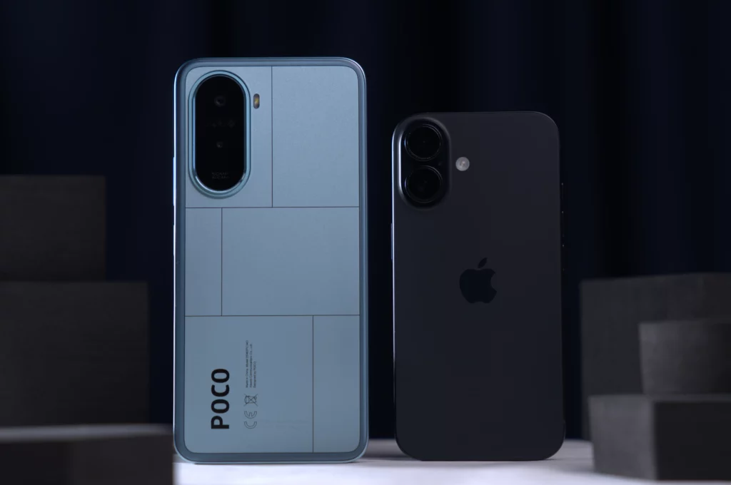 Back view of a light blue POCO smartphone with a geometric, segmented design next to a black iPhone with a case.