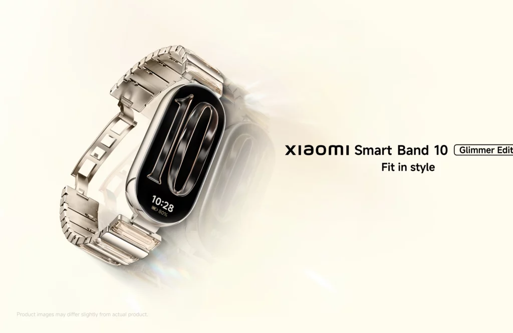 A close-up shot of the Xiaomi Smart Band 10 Glimmer Edition. The fitness tracker has a sleek black display and a metallic, shimmering, link-style wristband that wraps around the band. The number '10' is subtly visible in a large font on the display.