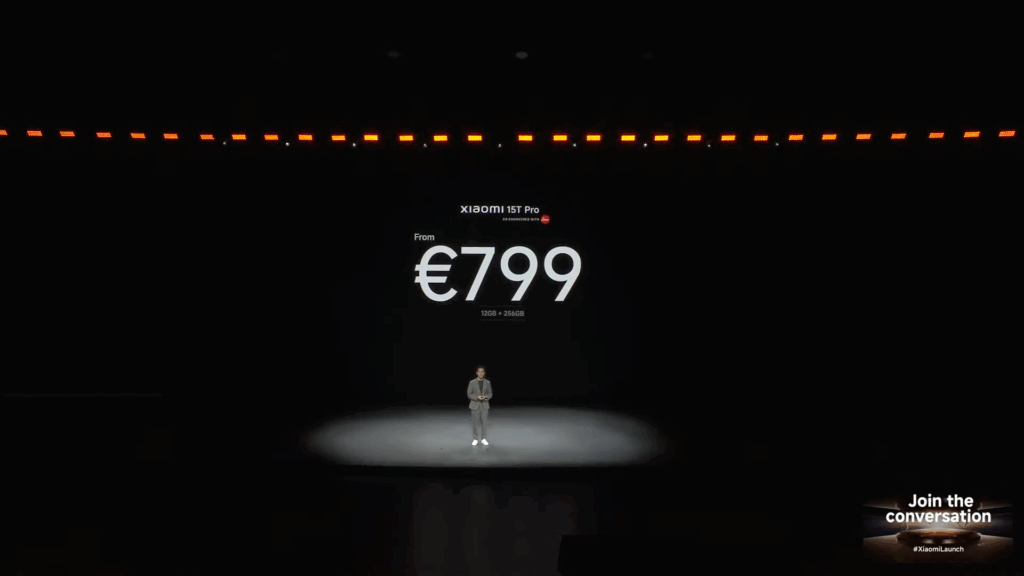A stage slide from the Xiaomi launch event announcing the starting price for the Xiaomi 15T Pro. The text displays "From €799" for the "12GB + 256GB" configuration. A presenter stands on a spotlighted area of the dark stage.