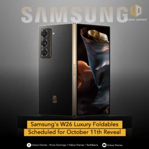 An advertisement for Samsung's W26 Luxury Foldables. The image features a black foldable smartphone with a gold frame and gold accents around its triple camera system. The phone is shown in a partially folded state, revealing both its outer back panel and a glimpse of its inner folding screen, which displays a dynamic, fabric-like wallpaper. The word "SAMSUNG" is in large, faded white text at the top. A yellow banner at the bottom announces, "Samsung's W26 Luxury Foldables Scheduled for October 11th Reveal."