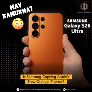 An advertisement questioning if Samsung is copying Apple's new orange iPhones. The image features a hand holding an orange Samsung Galaxy S26 Ultra smartphone, showcasing its triple camera setup. The text "MAY KAMUKHA?" (Tagalog for "Does it look similar?") is in large, white, distressed font at the top left, next to a confused emoji. The words "SAMSUNG Galaxy S26 Ultra" are on the right. A yellow banner at the bottom asks, "Is Samsung Copying Apple's New Orange iPhones?"