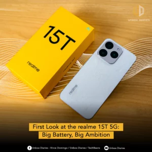 A white smartphone with a textured, pearlescent back and a large triple camera module is displayed next to its bright yellow rectangular box, which is labeled "15T realme." The image is a promotional photo with a digital overlay that includes the text "First Look at the realme 15T 5G: Big Battery, Big Ambition" at the bottom.