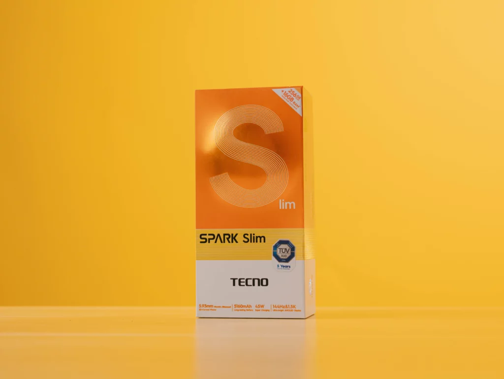 Full view of the orange retail box for the TECNO SPARK Slim smartphone, showing key specs like 256GB + 16GB RAM and 5.93mm thickness.