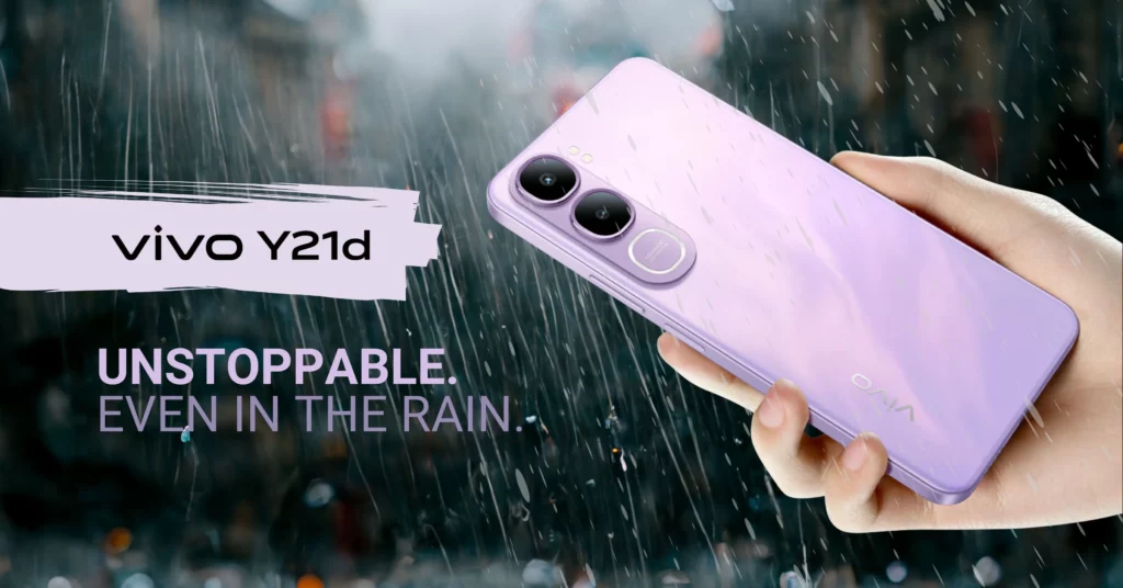 A hand holding the purple vivo Y21d smartphone in heavy rain. Large text overlay says: "vivo Y21d. UNSTOPPABLE. EVEN IN THE RAIN."