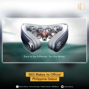 A social media graphic featuring a sleek, futuristic neck massager with multiple rotating massage nodes and a central red light heat element. The massager is grey and navy blue. The text overlay reads: "Dare to be Different, For the Better" and "SKG Makes its Official Philippine Debut." Branding for 'Unbox Diaries' is visible at the top and bottom.