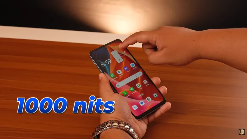 A close-up of a hand interacting with the screen of the OPPO A3x. Overlaid text highlights the screen brightness: "1000 nits".