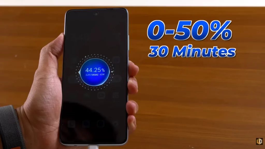 A hand holding the OPPO A3x while it is charging. The screen shows 44.25% charged with SUPERVOOC 45W displayed. Overlaid text reads: "0-50% 30 Minutes".
