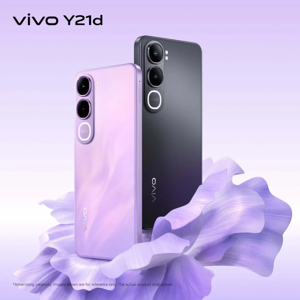 A studio shot showcasing two vivo Y21d smartphones: one in a vibrant lavender/purple color and one in black/dark gray, standing upright on large, soft purple petals. The vivo logo is visible.