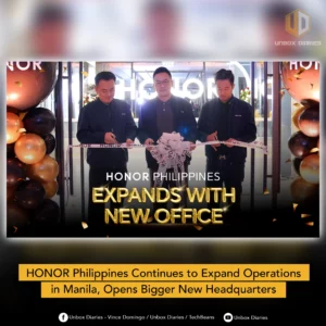 Three men in black shirts are cutting a white ribbon with "HONOR" written on it during an office opening ceremony, framed by black and gold balloons. The large text overlay reads: "HONOR PHILIPPINES EXPANDS WITH NEW OFFICE" and a smaller caption below reads: "HONOR Philippines Continues to Expand Operations in Manila, Opens Bigger New Headquarters".