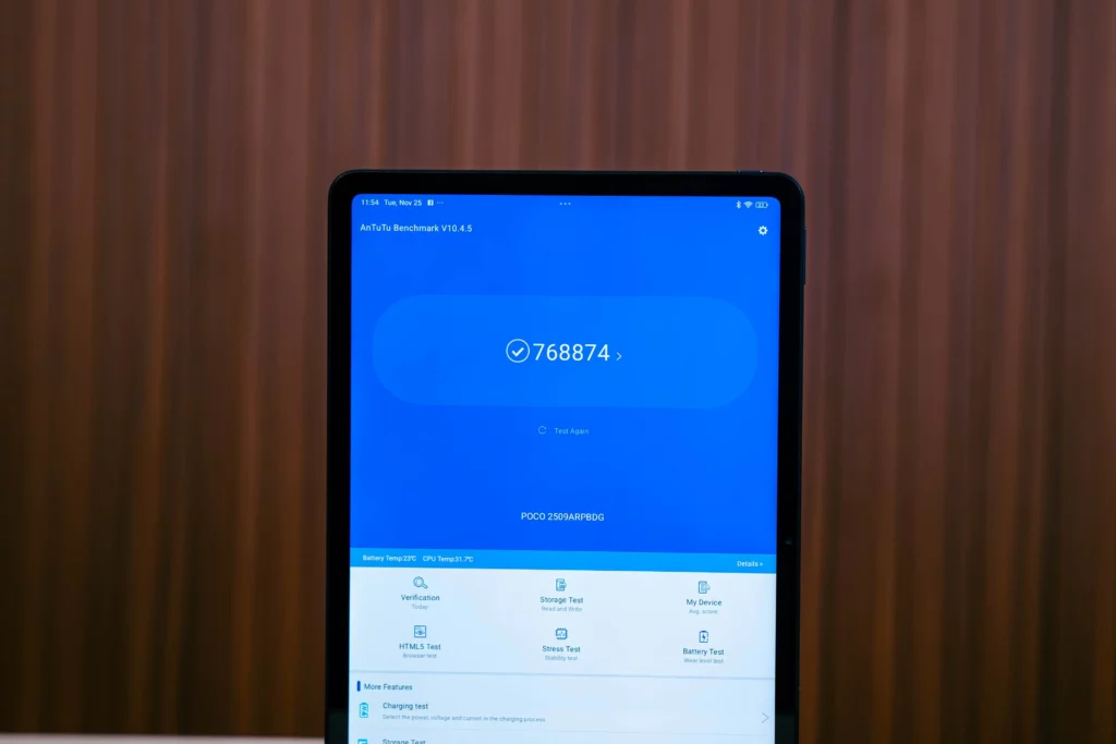The POCO Pad M1 tablet screen displaying the results of an AnTuTu Benchmark V10.4.5 test, showing a score of 768874 and other information like device model and testing options.