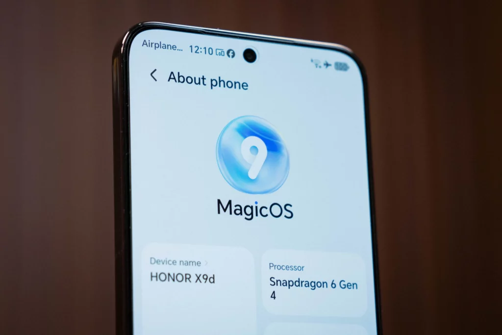 A close-up of the HONOR X9d 5G smartphone screen showing the "About phone" settings page. The display shows the MagicOS 9 logo and confirms the device name as "HONOR X9d" and the processor as "Snapdragon 6 Gen 4".