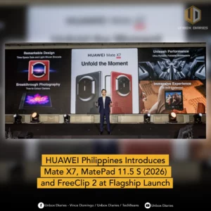 A wide shot of a stage at the HUAWEI Philippines flagship launch event. A presenter in a blue suit stands in the center holding two foldable phones. Behind him, a large screen displays the HUAWEI Mate X7 with the slogan "Unfold the Moment," alongside feature panels for "Remarkable Design," "Breakthrough Photography," "Unleash Performance," and "Immersive Experience."