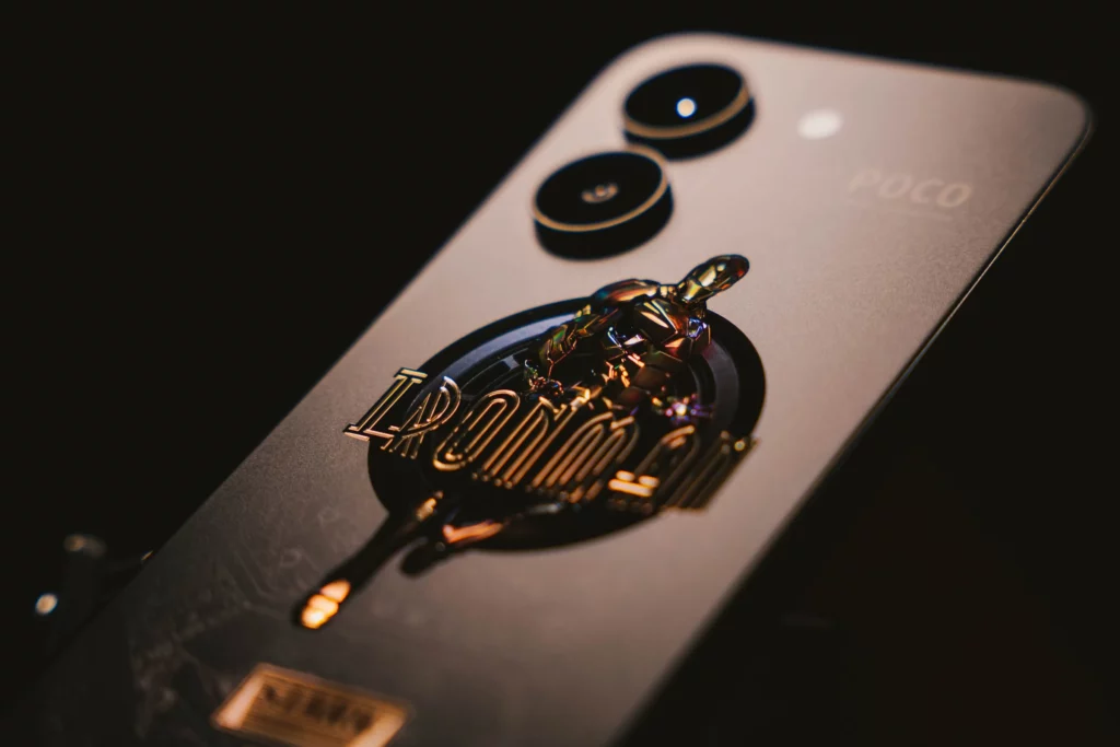 A stylistic shot of the POCO X8 Pro Iron Man Edition with an emphasis on the Iron Man design at the back.