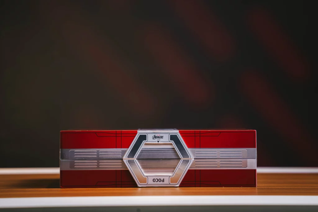 The side profile of the POCO X8 Pro Iron Man Edition's box with the Marvel Avengers branding and POCO branding.