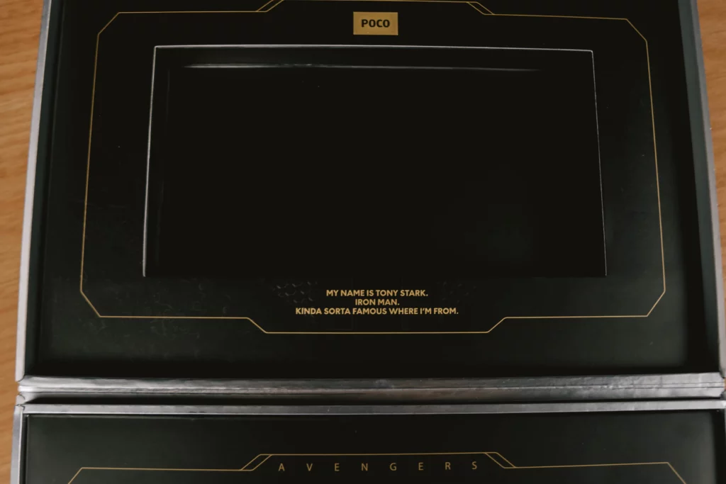 The top part of the POCO X8 Pro Iron Man Edition's box with a POCO branding on top and a statement at the bottom saying "My Name is Tony Stark. Iron Man. Kinda Sorta Famous Where I'm From."