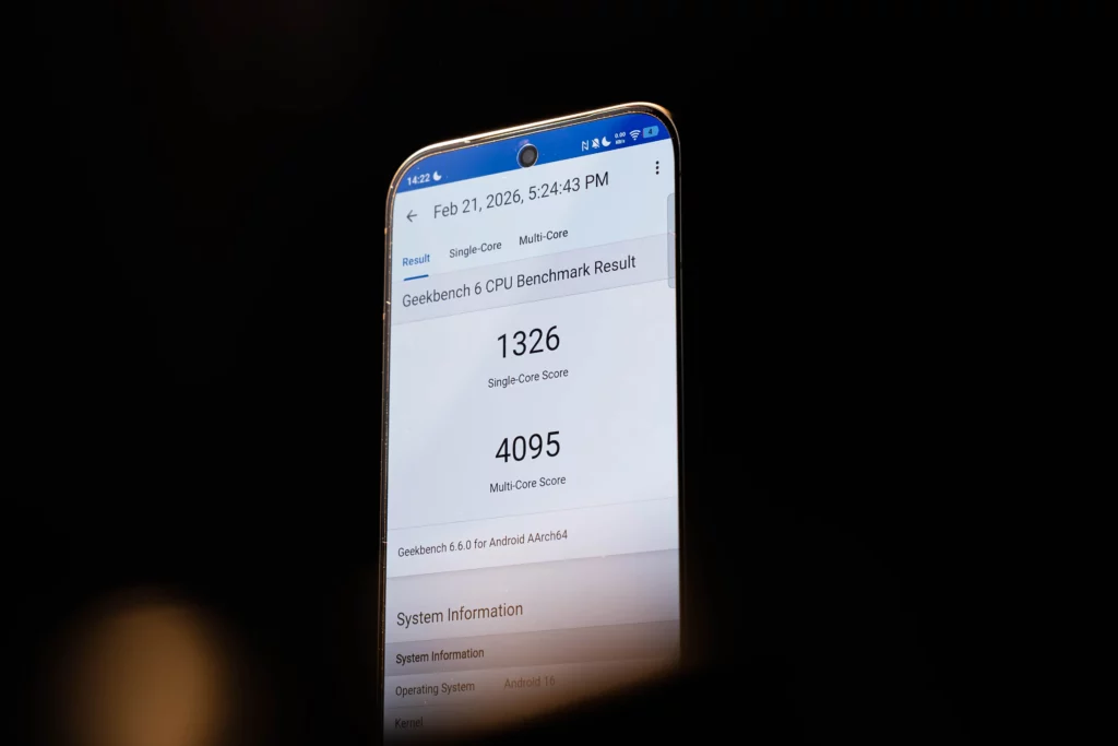 A close-up of the screen showing Geekbench 6 CPU benchmark results: a Single-Core Score of 1326 and a Multi-Core Score of 4095, running on Android 16.