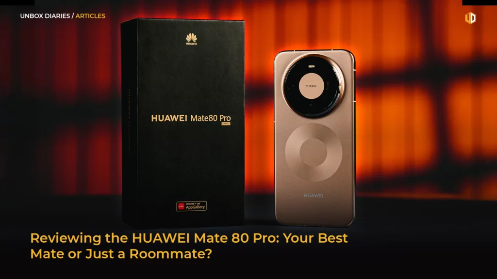 A professional product shot for an article titled "Reviewing the HUAWEI Mate 80 Pro: Your Best Mate or Just a Roommate?" The image features a black retail box embossed with gold lettering next to the back of a bronze-colored HUAWEI Mate 80 Pro smartphone. The phone prominently displays a large, circular XMAGE camera module and a matte metallic finish. The background is a warm, blurred orange and black setting.