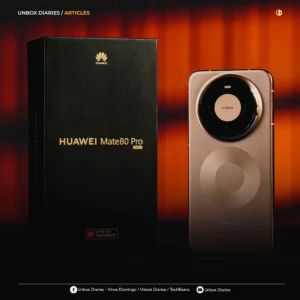 A high-quality studio shot of the Huawei Mate 80 Pro and its packaging. On the left is a sleek black vertical box with "HUAWEI Mate 80 Pro" printed in gold lettering. On the right, the back of the smartphone is displayed in a metallic bronze finish, featuring a large, centered circular camera housing with "XMAGE" branding and a unique concentric circle design etched into the lower back panel.