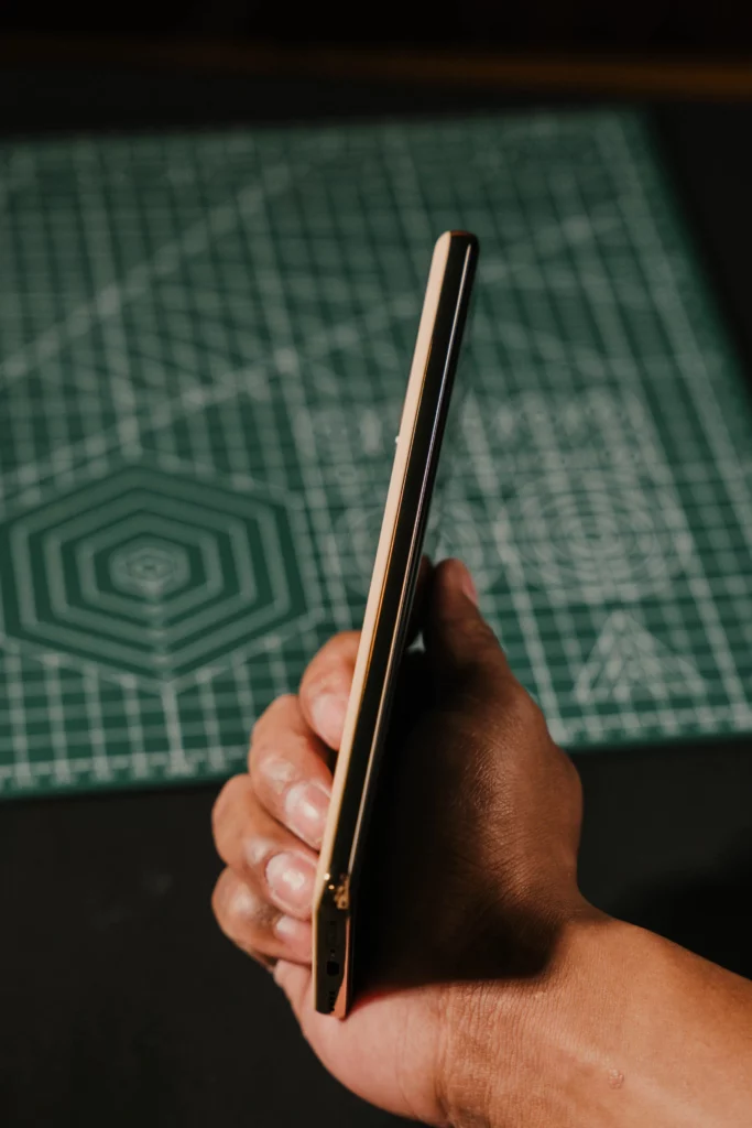 A hand holding the other side of the realme 16 Pro+ 5G's side profile.