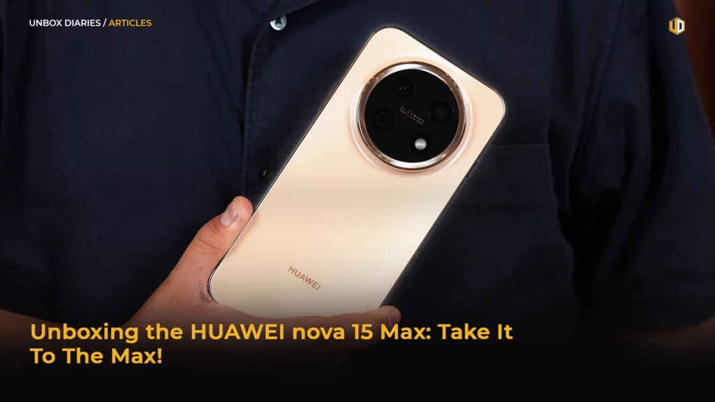 A landscape digital banner titled "UNBOX DIARIES / ARTICLES" in the upper-left corner, featuring a close-up shot of a hand holding the back of a champagne gold HUAWEI smartphone. The phone features a prominent, large circular camera module with a gold-rimmed edge housing multiple lenses and an LED flash. The text "HUAWEI" is subtly printed near the bottom of the device. Overlaying the dark bottom portion of the image is bold yellow text that reads, "Unboxing the HUAWEI nova 15 Max: Take It To The Max!".