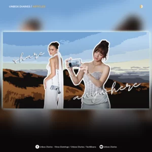 A digital banner featuring a stylized, illustrated background of rolling hills under a blue sky. On the left, a woman in a white gown stands looking over her shoulder with a camera accessory slung over her back. On the right, another woman in a lace corset top holds up a silver smartphone featuring a large camera lens attachment. Cursive white text reads "share anywhere". The top header says "UNBOX DIARIES / ARTICLES" and the bottom includes social media handles for Unbox Diaries and TechBeans against a dark background.