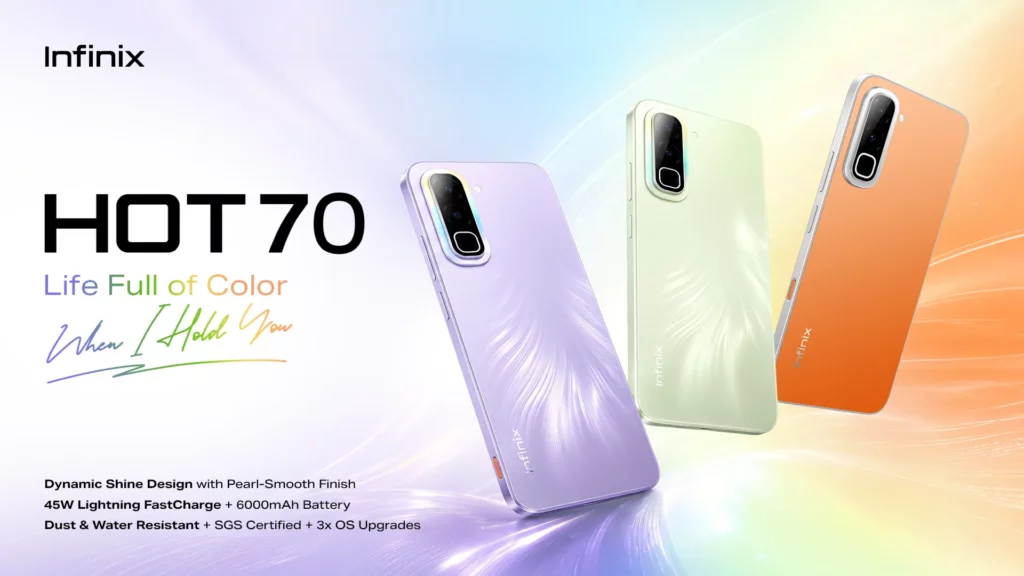 Promotional banner for the Infinix HOT 70 smartphone series featuring the tagline "Life Full of Color, When I Hold You" against a soft, rainbow-gradient background. Three phones are shown floating at an angle to showcase their back panels: one in a light violet with a flame-like texture, one in a pale pastel green with a similar texture, and one in solid matte orange. Text at the bottom highlights key features: Dynamic Shine Design with Pearl-Smooth Finish, 45W Lightning FastCharge + 6000mAh Battery, and Dust & Water Resistant + SGS Certified + 3x OS Upgrades.