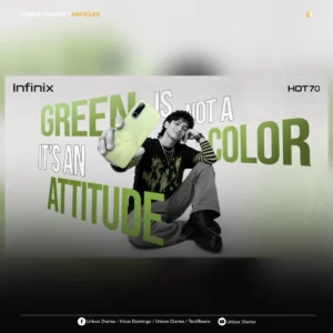 Promotional banner for the Infinix HOT 70 smartphone. A stylish person with dark, textured hair sits on a white background, wearing a black shirt with a green flame pattern over a striped long-sleeve shirt and grey cargo pants. They are holding up a light green Infinix HOT 70 phone to show its rear design, featuring a feather-like pattern and a prominent rectangular camera module. Bold, stylized text surrounding the individual reads, "GREEN IS NOT A COLOR IT'S AN ATTITUDE." The Infinix brand logo is in the top-left corner, and "HOT 70" is in the top-right.