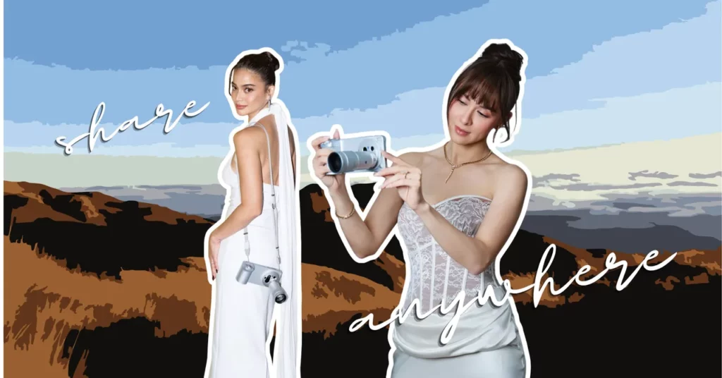 A cropped, widescreen graphic with a stylized illustration of rolling brown mountains and a blue sky in the background. Two women with their hair in buns are featured as cutouts. On the left, a woman in a white backless dress looks backward with a silver camera accessory strapped across her shoulder. On the right, a woman in a white lace corset holds up a silver vivo smartphone with a prominent telephoto camera lens extension. White cursive text layered over the image reads "share anywhere".