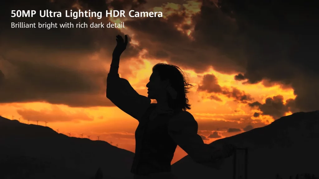 A high-contrast silhouette of a person posing against a dramatic orange and gold sunset sky with clouds and mountain outlines. Text overlay reads: "50MP Ultra Lighting HDR Camera. Brilliant bright with rich dark detail."