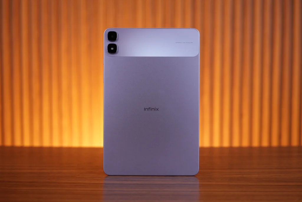 Full rear view of the purple Infinix XPAD 30 Pro tablet standing upright, showing its dual-tone back panel and dual-camera module.