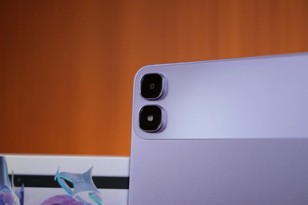 Extreme close-up shot focusing on the rear dual-camera module and flash ring on the upper-left corner of the purple Infinix XPAD 30 Pro.